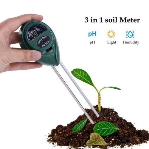 Hand holding 3-in-1 soil tester meter with metal probes